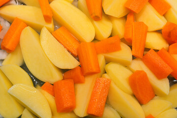 sliced vegetables prepared for cooking. potato, carrot