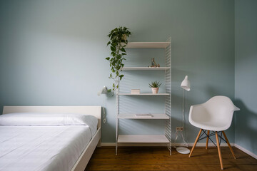 Interior of stylish bedroom with folding screen
