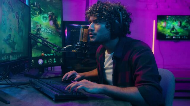 African American man male guy streamer play game online network winner achievement victory first place championship computer pc delighted amazement celebrate emotional goal prize tournament triumph