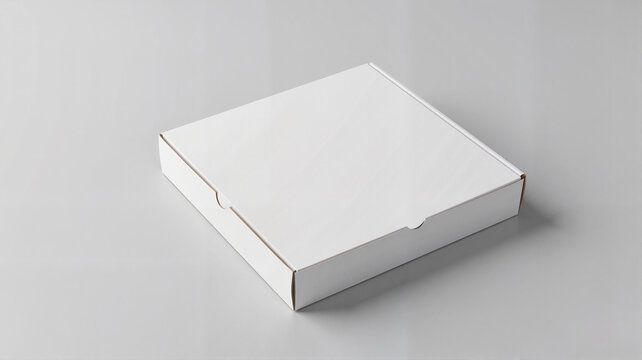 Plain white pizza box on gray surface