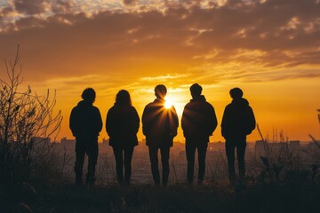 Silhouettes of Five Friends at Sunset, Enjoying Nature Together
