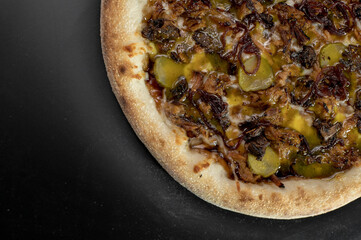 details of the pizza application; juicy pizza from the oven with mushrooms, tomatoes and bacon and sprinkled with parmesan cheese