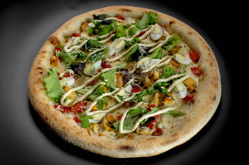 details of the pizza application; juicy pizza from the oven with mushrooms, tomatoes and bacon and sprinkled with parmesan cheese