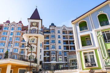 Obraz premium Multicolored modern balconies. Facade of Colorful Houses Buildings. Bright windows architecture. Condominium