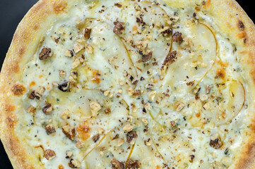 details of the pizza application; juicy pizza from the oven with mushrooms, tomatoes and bacon and sprinkled with parmesan cheese