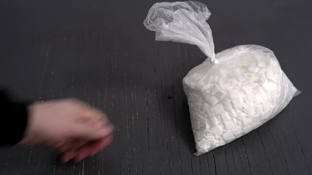 Packets of white matter. Bags with white granules. Hexogen packets. Pouches with tablets.