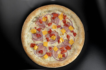 details of the pizza application; juicy pizza from the oven with mushrooms, tomatoes and bacon and sprinkled with parmesan cheese