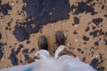 Fuel oil stains on the Black Sea coastline. Environmental disaster, environmental pollution. Oil...