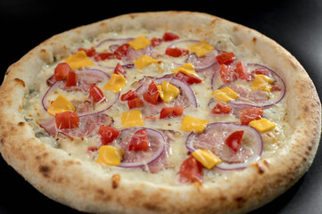 details of the pizza application; juicy pizza from the oven with mushrooms, tomatoes and bacon and sprinkled with parmesan cheese