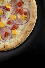 details of the pizza application; juicy pizza from the oven with mushrooms, tomatoes and bacon and sprinkled with parmesan cheese