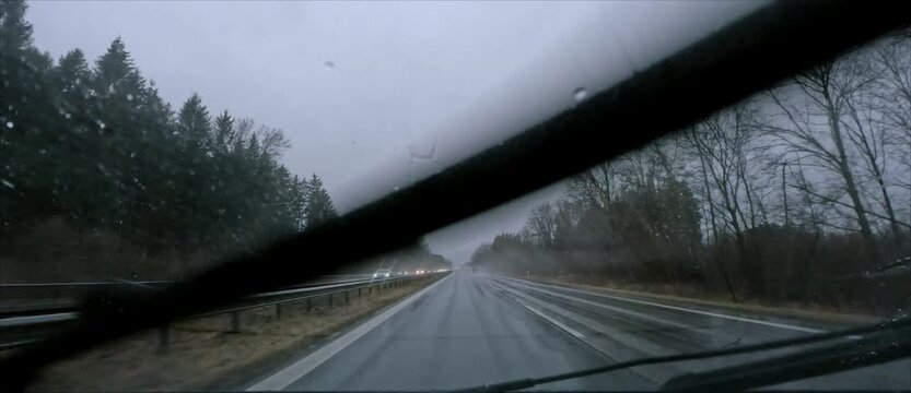 POV: Driving on German Autobahn on a rainy day in winter 