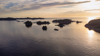 Sunset over a small archipelago of tiny islands sitting off the west coast of British Columbia 