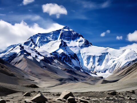Snow-Capped Mountain Peak Against a Blue Sky