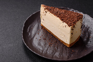 Slice of sweet cheesecake sprinkled with chopped chocolate
