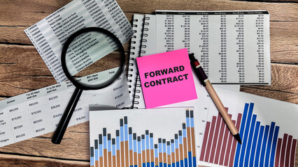 Concept of Forward Contract write on sticky notes isolated on Wooden Table.