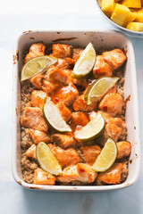 Teriyaki baked salmon with pearl barley and limes, served with pineapple 