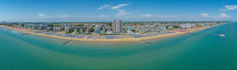 Italy, Jesolo near Bibione. Lido di Jesolo, or Jesolo Lido, is the beach area of the city of Jesolo in the province of Venice, Aerial View with sandy beach and with an endless parasols
