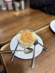 Traditional milky crispy Ramadan dessert custard pudding with roasted kadayif and diced pistachio . Kadayifli Muhallebi