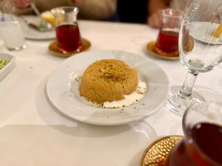 Semolina dessert with ice cream served at restaurant