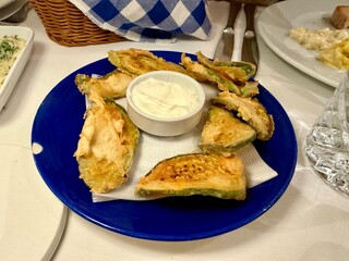 Baked zucchini with yogurt and garlic as appetizer