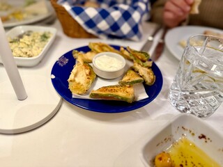 Baked zucchini with yogurt and garlic as appetizer