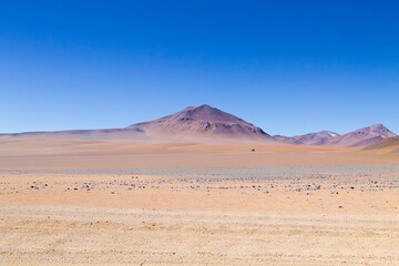 Desert landscape with mountains under blue sky