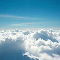 Naklejka premium High-altitude snow cloud against a bright blue sky, rugged landscape, soft, mountainous terrain