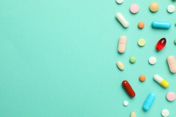 Various pills on a colored background