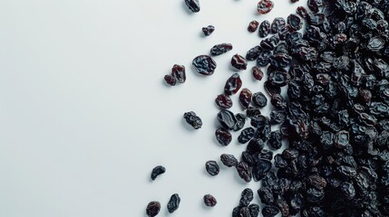 Scattered Black Raisins on White Background