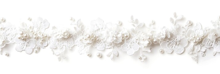 Obraz premium Elegant white lace trim adorned with delicate flowers and pearls, perfect for bridal accessories.