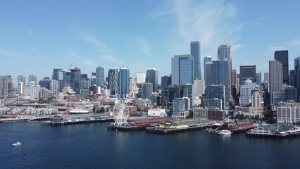 Aerial View of Urban City Skyline and Waterfront Port Area with Ferris Wheel