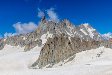 High altitude mountain landscape in the Alps. View from the observation point at Montblanc area. Dent du Gigante summit and white snow covered glacier