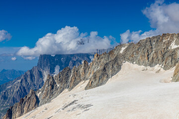 High altitude mountain landscape in the Alps. View from the observation point at Montblanc area. Dent du Gigante summit and white snow covered glacier