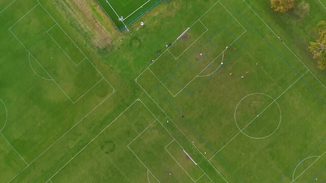 Aerial drone shot of a football pitch in the middle of a park in Bishops Stortford, England