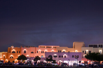 Colorful houses at night in the Old Port area of ​​Doha, Qatar
