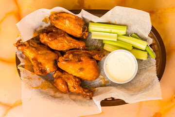 Chicken wings with celery and ranch dressing