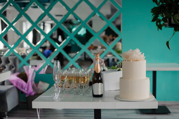 Elegant Celebration Table with Champagne and Decorative Cake