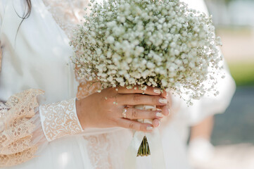 Elegant Bride Holding Delicate Baby's Breath Bouquet
