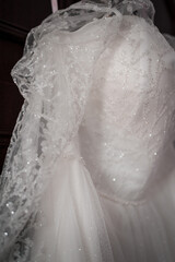 Ethereal Wedding Gown with Intricate Beading and Sheer Veil
