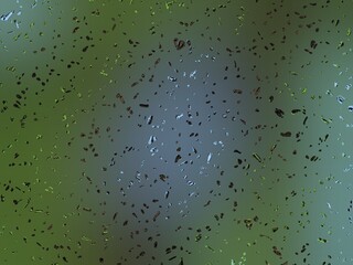 Abstract speckled background with metallic particles scattered on a blurred green and gray gradient.