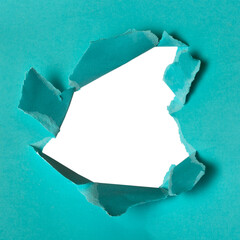 Close up torn blue paper hole background. Hole isolated on white background