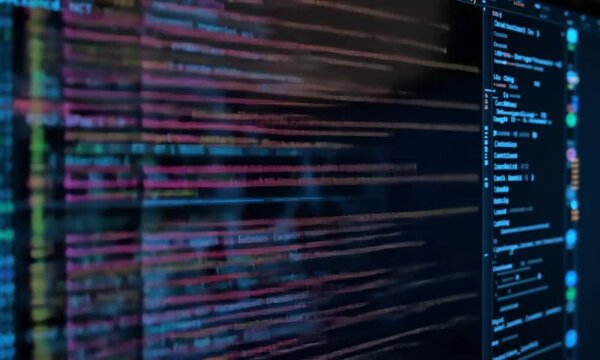 Cybernetic Symphony: A Close-Up of Colorful Code on a Computer Screen