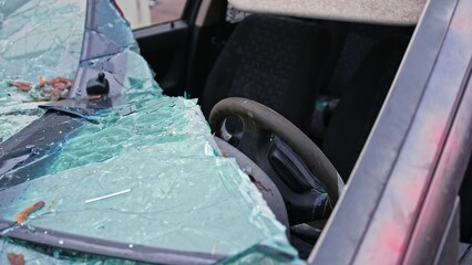 Fototapeta premium Damaged Car with Shattered Windshield from Road Accident Scene