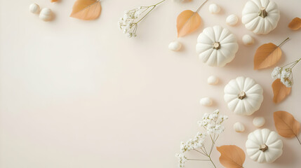 A serene arrangement of white mini pumpkins and delicate leaves on a soft background, perfect for autumn decor.