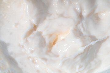 Milk water liquid white color drink and food texture background, Beautiful natural caw milk wave and bubble splash texture with macro on top view, Healthy food daily