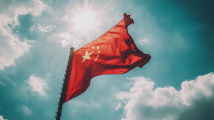 Chinese soldier standing proudly in front of the national flag.