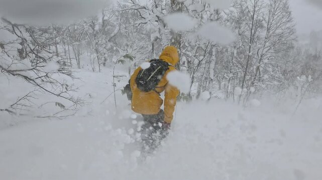POV: Two extreme snowboarders carve through Hokkaido’s deep powder. One wears a yellow jacket, the other red pants and black puffer, gliding between trees on untouched snow. Epic winter powder ride