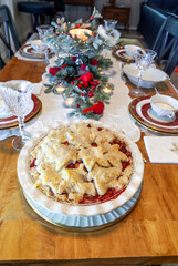 Apple and cranberry pie with crust including maple leaf design