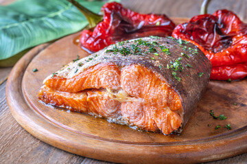 Baked Salmon with Bell Peppers on Rustic Wooden Cutting Board