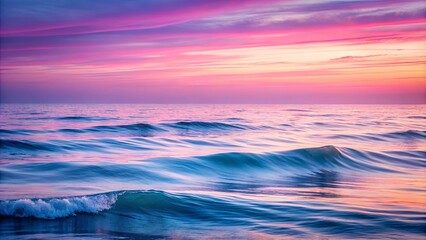 Obraz premium Ocean Waves Reflecting a Serene Pink and Blue Sunset